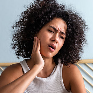 Woman experiencing tooth pain