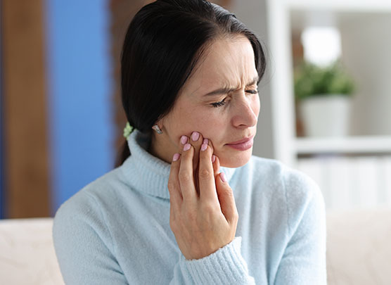 Woman experiencing tooth pain